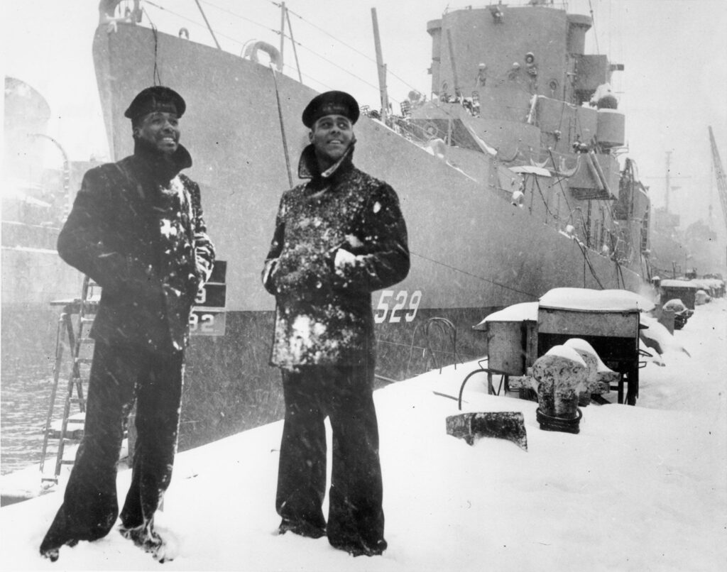 Two African American Sailors Stand in Front of USS Mason (Destroyer escort: DE-529)