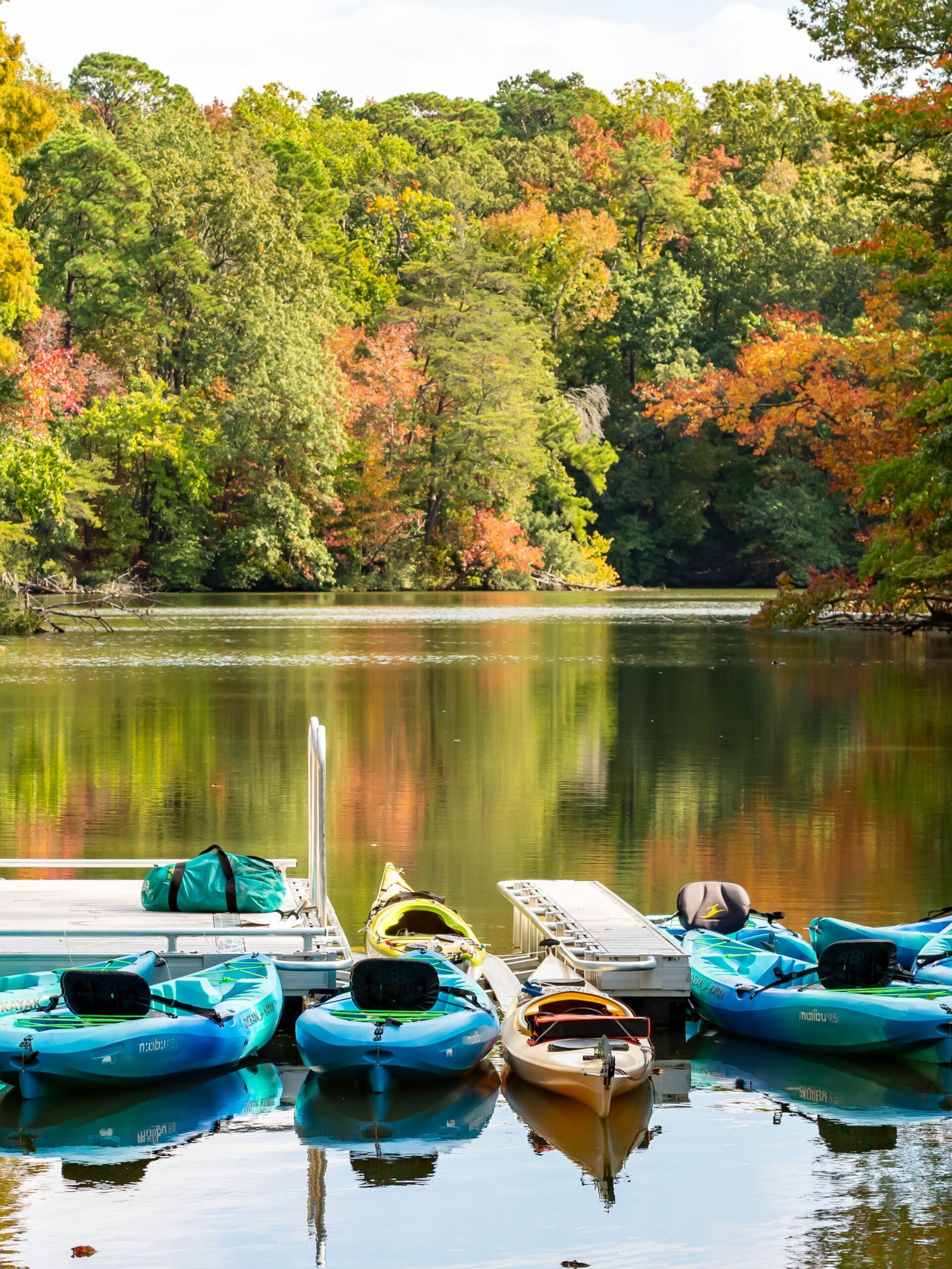 These kayaks on Mariners’ Lake are considered boats since they are small vessels that travel on the water.